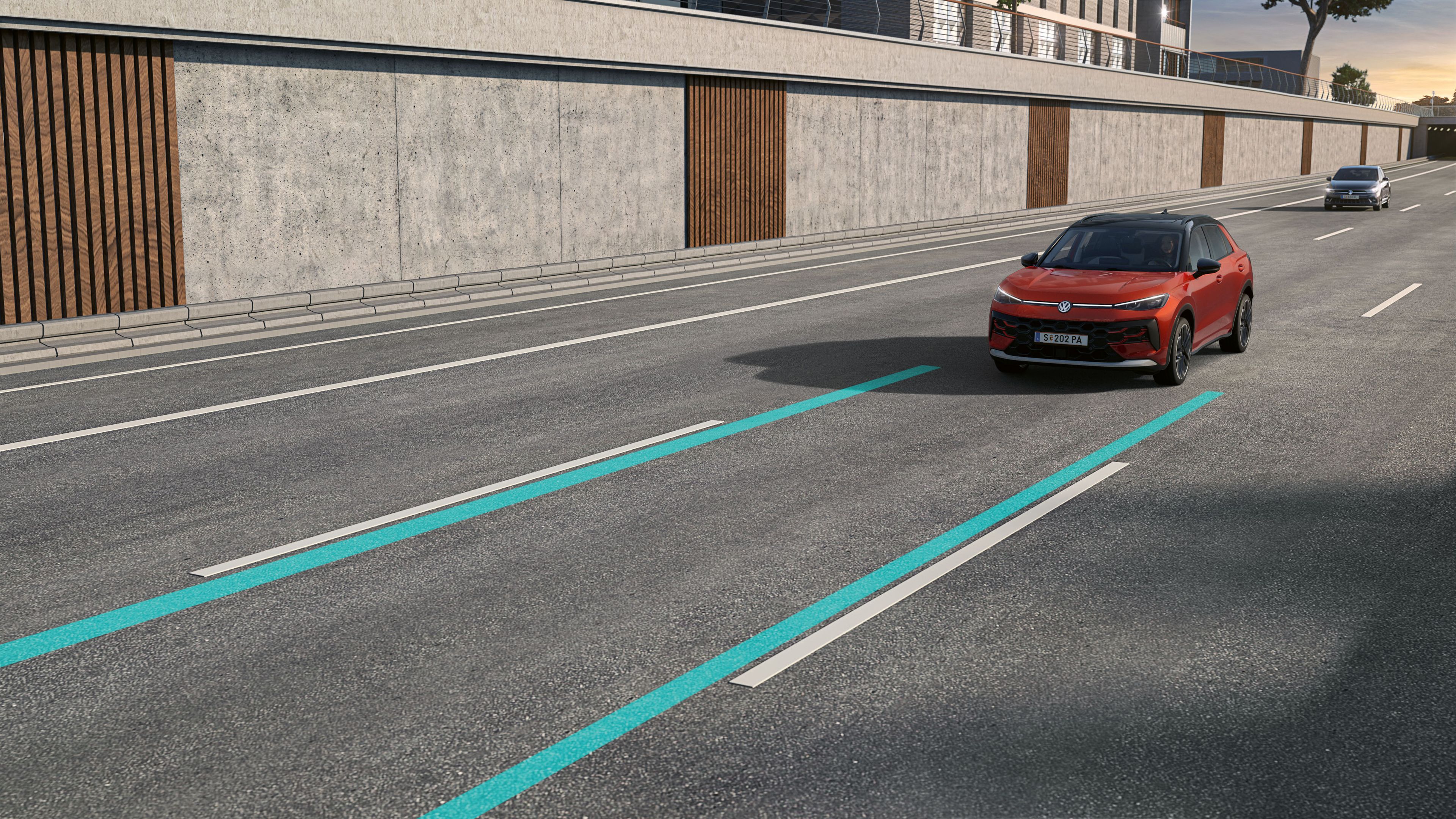 Ilustrácia schematicky znázorňuje fungovanie systému Lane Assist na príklade vozidla VW T-Roc.