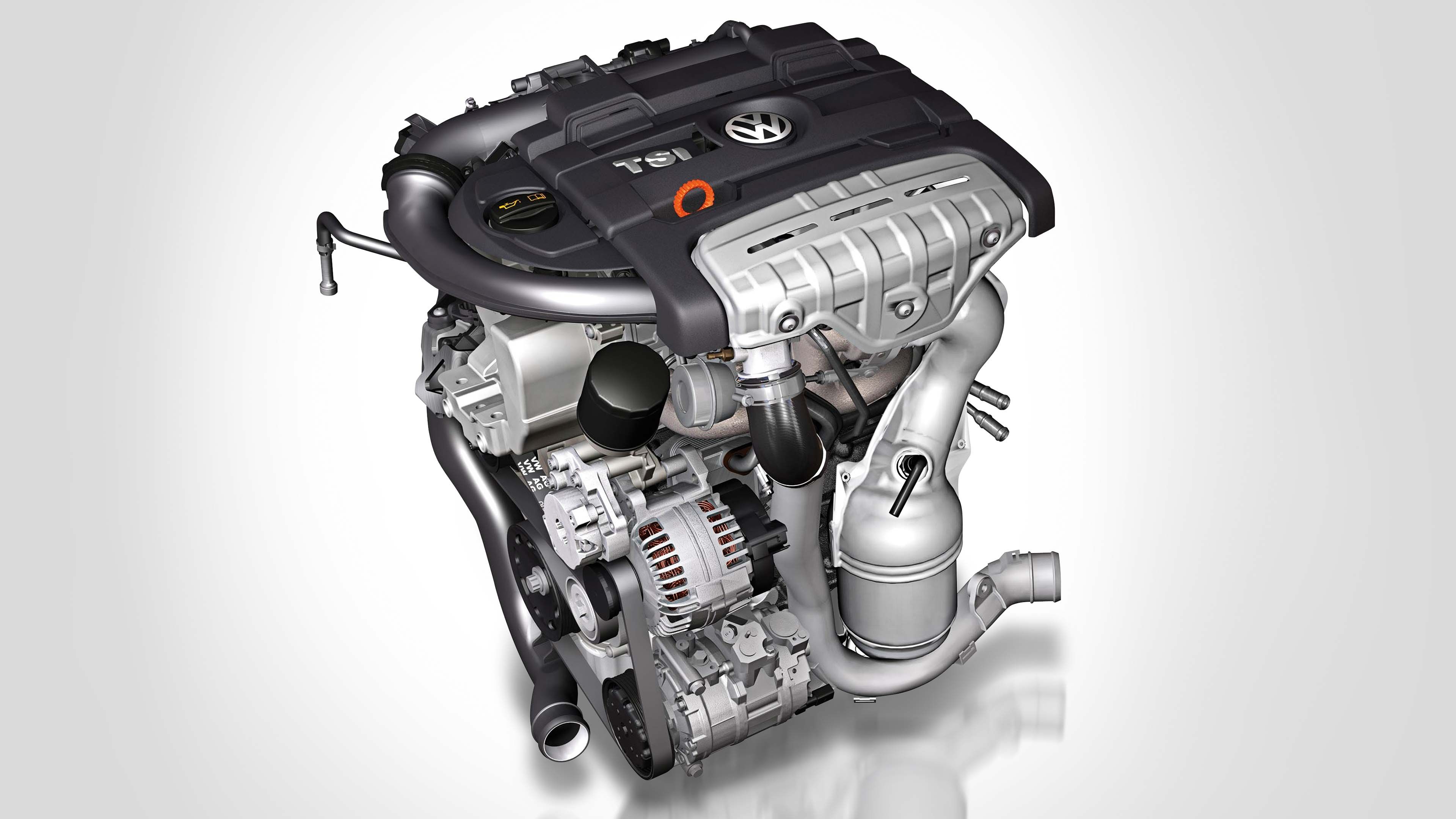 Motor automobilu značky Volkswagen. Na motore vidieť logo VW a niektoré komponenty ako alternátor a turbo.