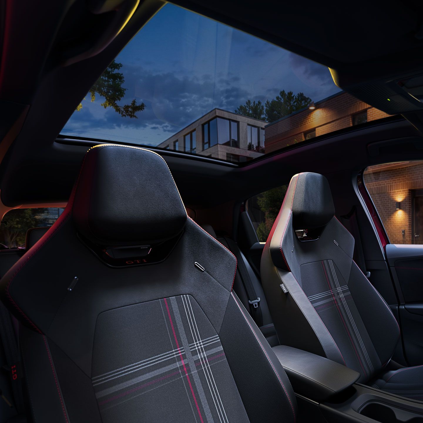 Pohľad na predné sedadlá modelu VW ID. Polo GTI s karovaným vzorom GTI.