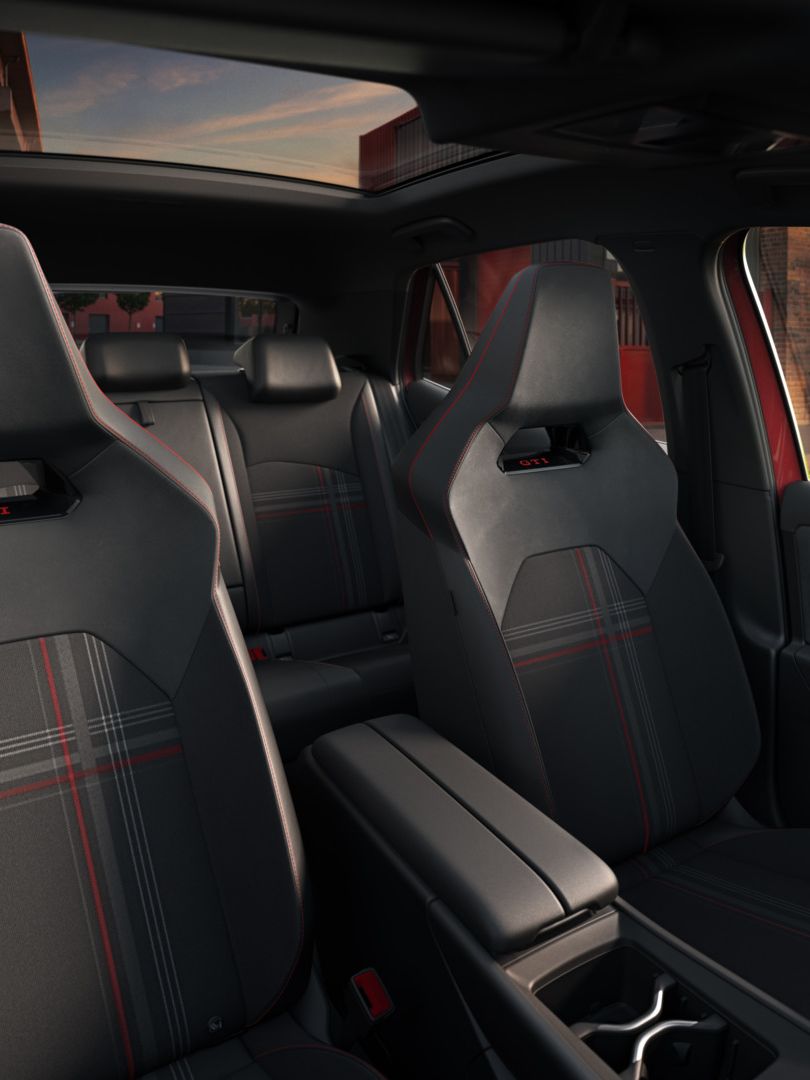 [AI-modified] – Pohľad na predné sedadlá VW ID.3 GTI s karovaným vzorom GTI