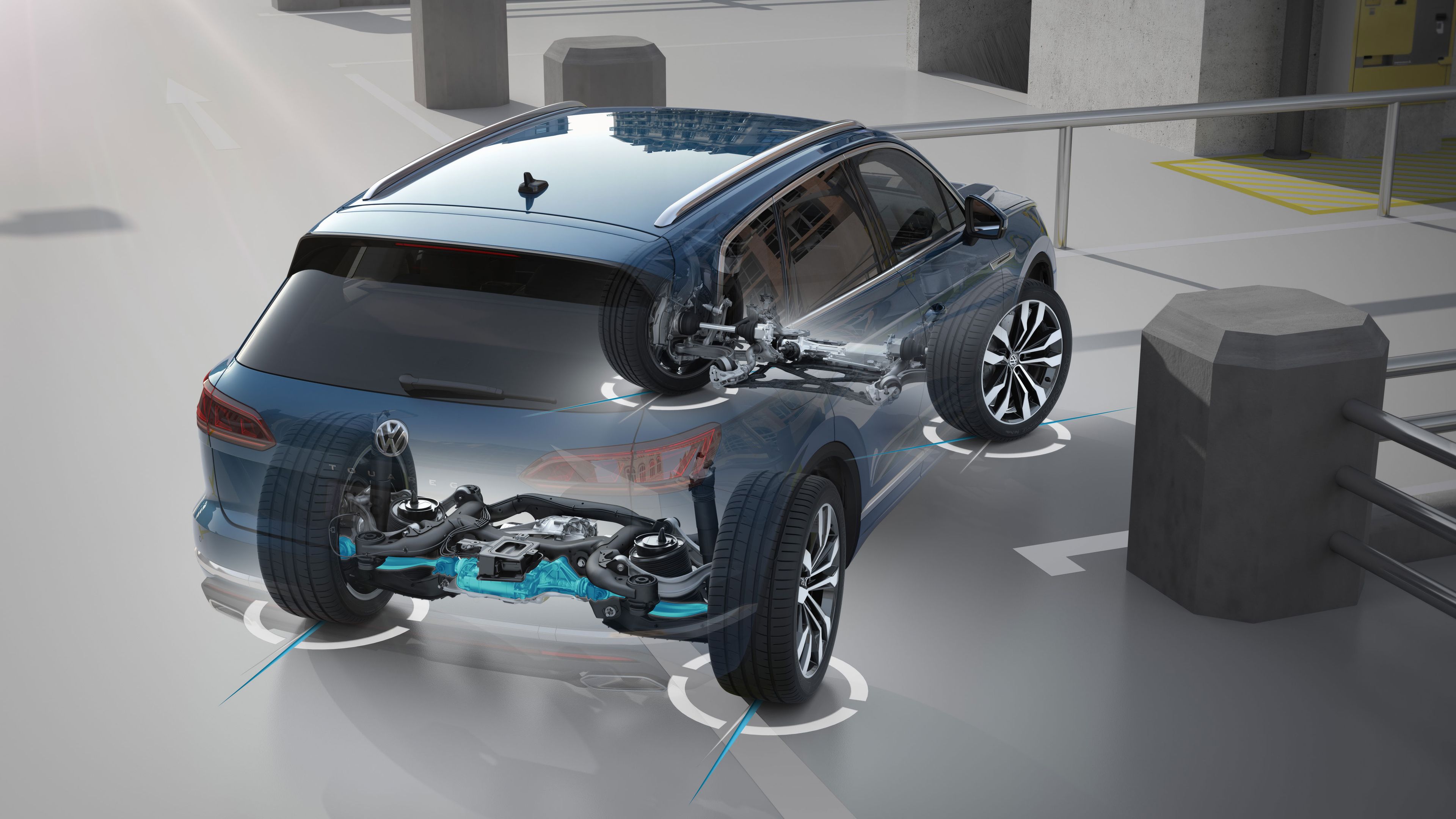Modré SUV je zobrazené v parkovacej garáži s transparentným zobrazením jej vnútorného mechanizmu riadenia všetkých kolies. Auto využíva najmodernejšie systémy na pomoc pri manévrovaní s vozidlom v stiesnených priestoroch.
