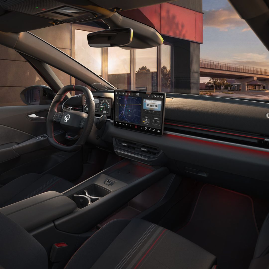 [AI-modified] – Pohľad na systém infotainment a dekór VW ID.3 GTI krátko pred západom slnka