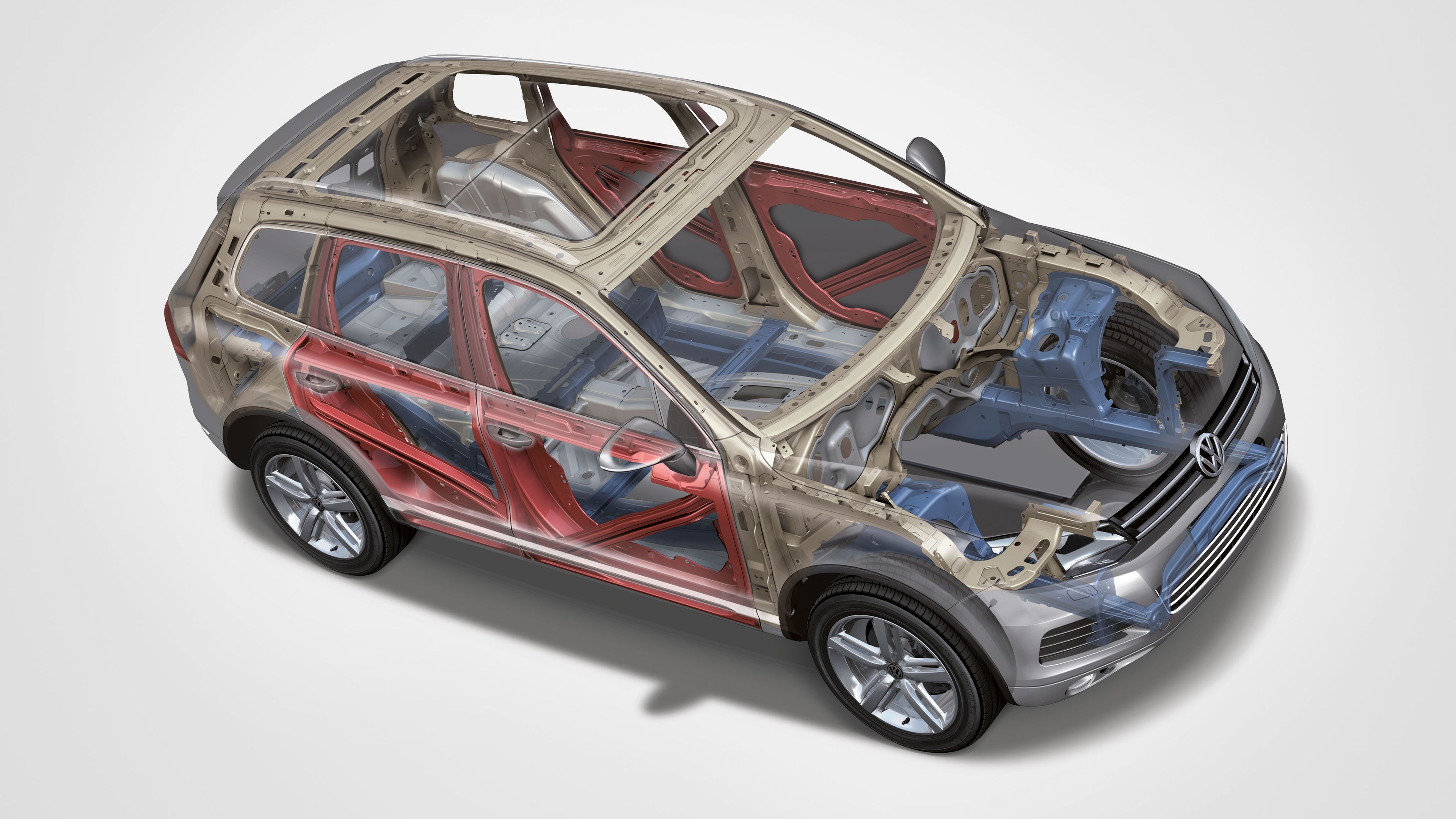Zobrazenie konštrukcie automobilu s odkrytými časťami karosérie. Na obrázku sú zvýraznené rôzne kovové komponenty a prvky vozidla. Vozidlo má šedú farbu a vidno detaily rámu.